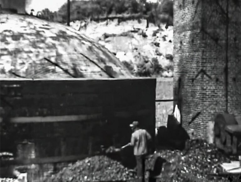 The DC Government wanted this site for a prison because the land provided a resource-rich environment that could become a brickyard. The prison opened in 1910 and by 1911 there were two beehive kilns operational with plans to build 10 more kilns and create an estimated 40,000 bricks per day. Loading the Brick Kiln, Orsinger Prison Farm Footage. Lorton Prison Museum Collection.