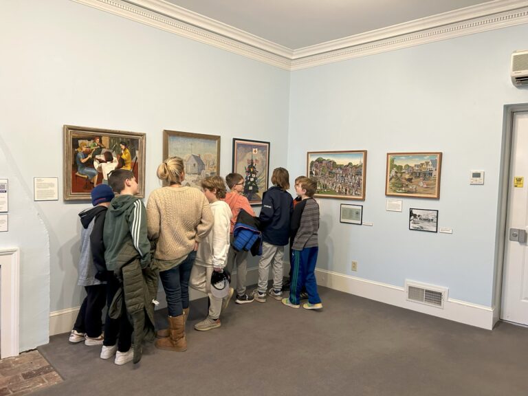 Fourth graders exploring the art exhibit, 2024. Brick Store Museum