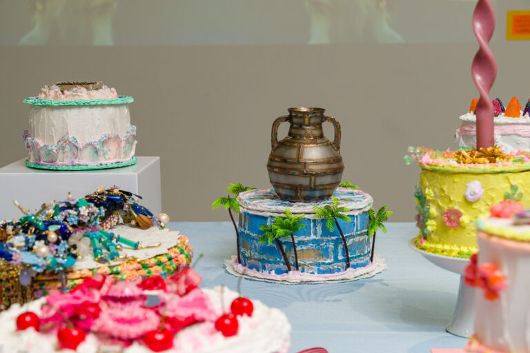 Installation view of We Want Cake! Let’s Eat Cake!, curated by Doris Chou-Durfee, featuring 16 contemporary jewelry artists. Inspired by Marie Antoinette’s misquote, kawaii culture, and Elisa Sung’s Cake Picnic, the exhibition celebrates joy as rebellion at NYCJW25. Photo: Simon Leung