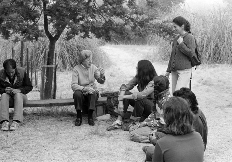 Morning Break: Marguerite Wildenhain with students under the peach tree. David Stone