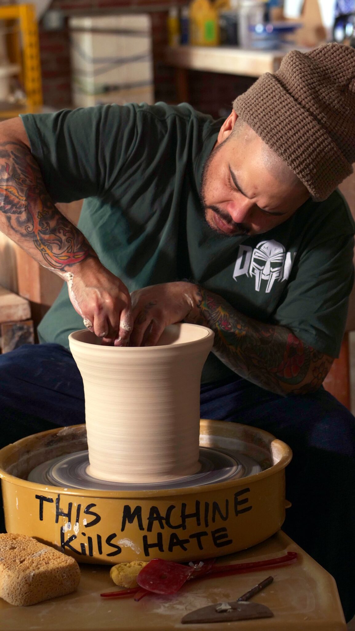 Potter Roberto Lugo at the potter's wheel. Denise Kang photograph