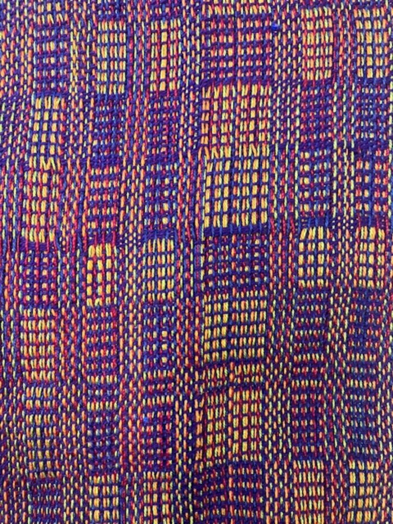 Colorful and vibrant handwoven fabric woven on a Macomber four shaft floor loom by TD at Arlington Weaves ETC. Emily Wroten