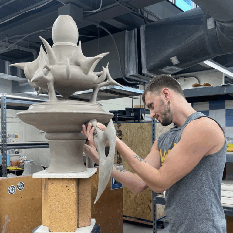 Image of Brady Fanning working in his studio. Baltimore Clayworks