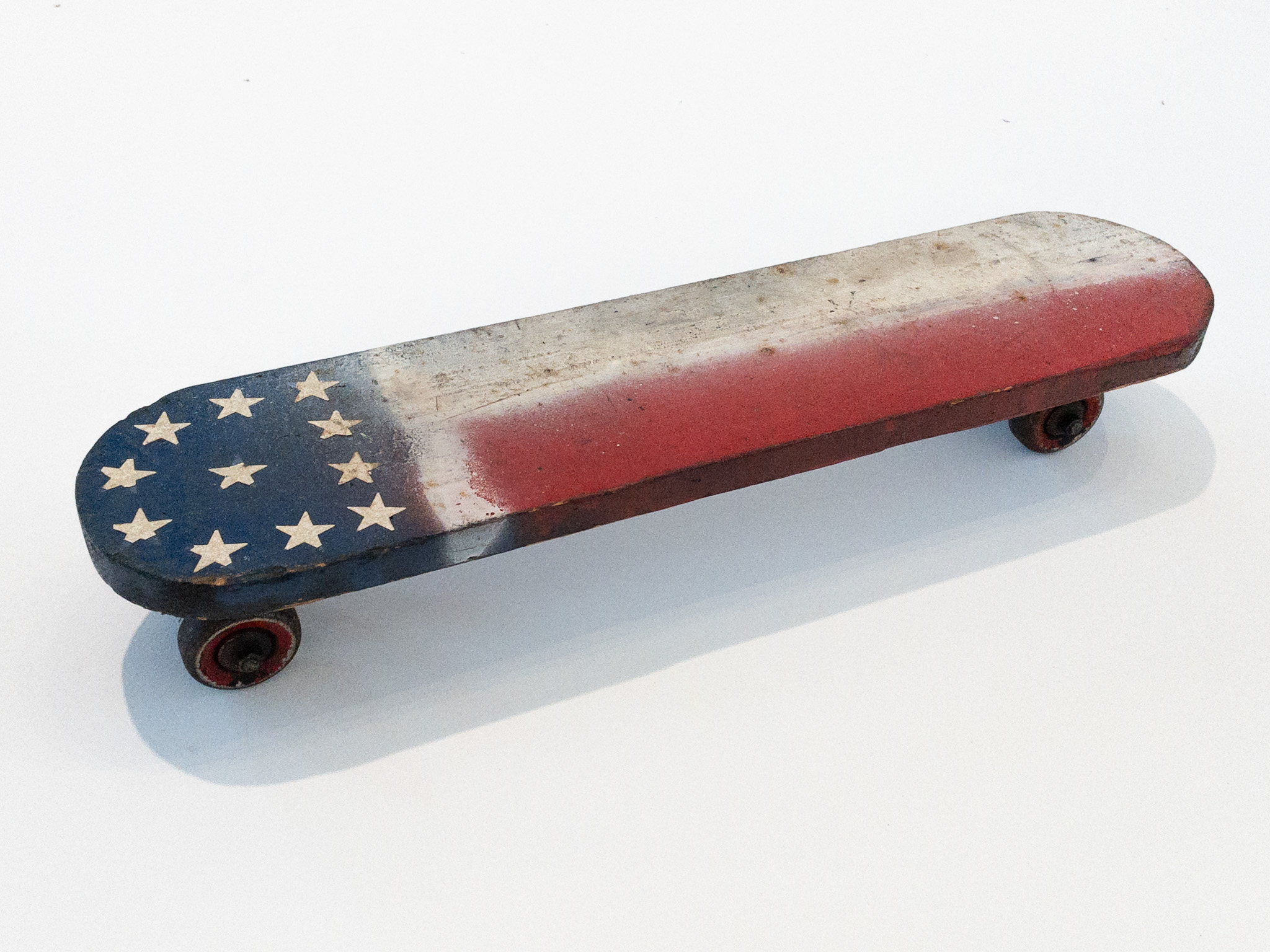 Vintage Homemade Flag Skateboard c. 1950s. Courtesy of the Skateboarding Hall of Fame and Museum