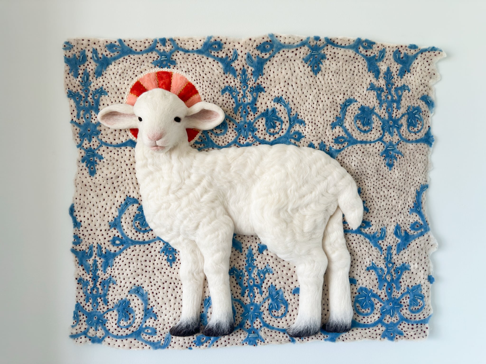 Holly Guertin, Lamb of God, 2026, wool wet- and needle-felt, embroidery, 39"w x 32"h x 4"d. Holly Guertin