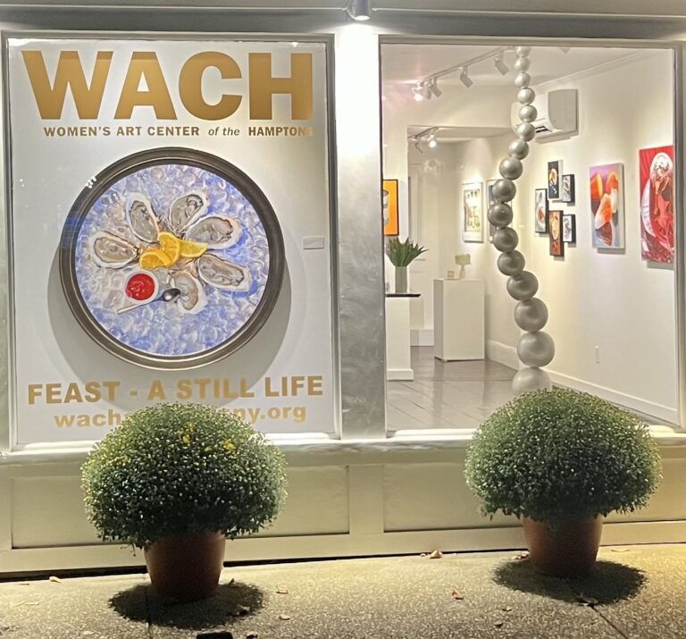 Women’s Art Center of the Hamptons window featuring works by Nadine Robbins and Jerelyn Hanrahan from the 2024 exhibition, ‘Feast – A Still Life.’ Women's Art Center of the Hamptons window featuring works by Nadine Robbins and Jerelyn Hanrahan from the 2024 exhibition, 'Feast - A Still Life.' Women's Art Center of the Hamptons