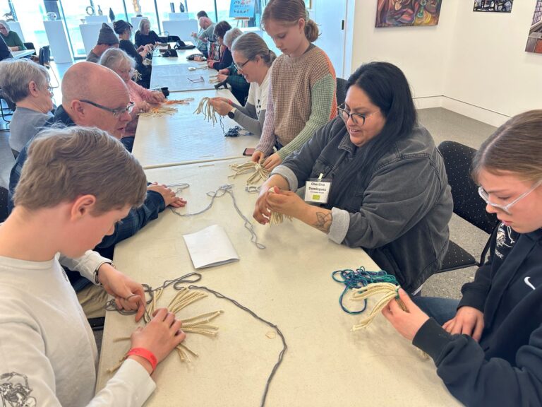 Chestina Dominguez (right center) teaching students to make wa'paas baskets. Courtesy Maryhill Museum of Art