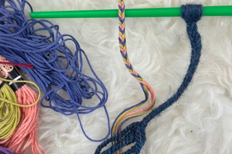 Colored yarn being braided. American Swedish Institute