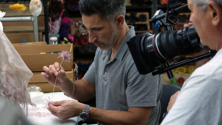 Fourth-generation co-owner Adam Brand handcrafts a fabric flower at M&S Schmalberg’s New York City studio. Craft in America