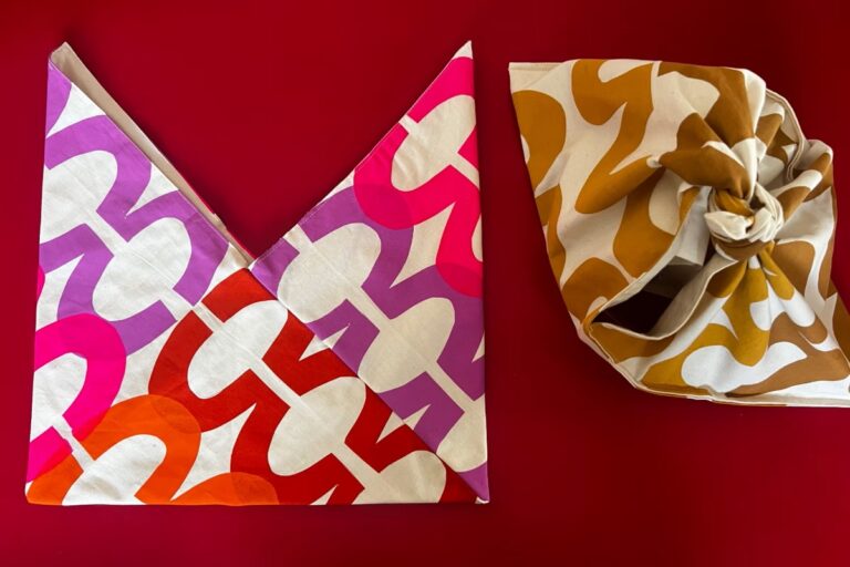 Two patterned cloth bags, one folded, one tied. American Swedish Institute