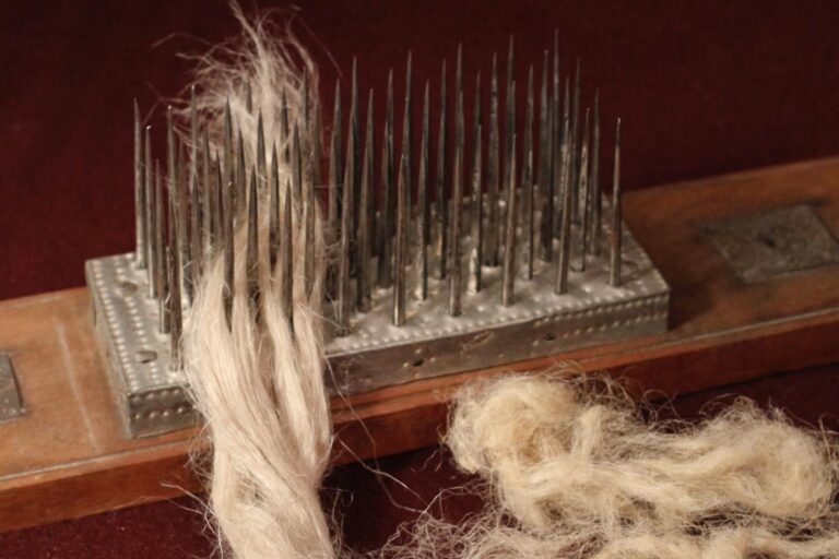 Flax fibers are combed on a heckling board. American Swedish Institute