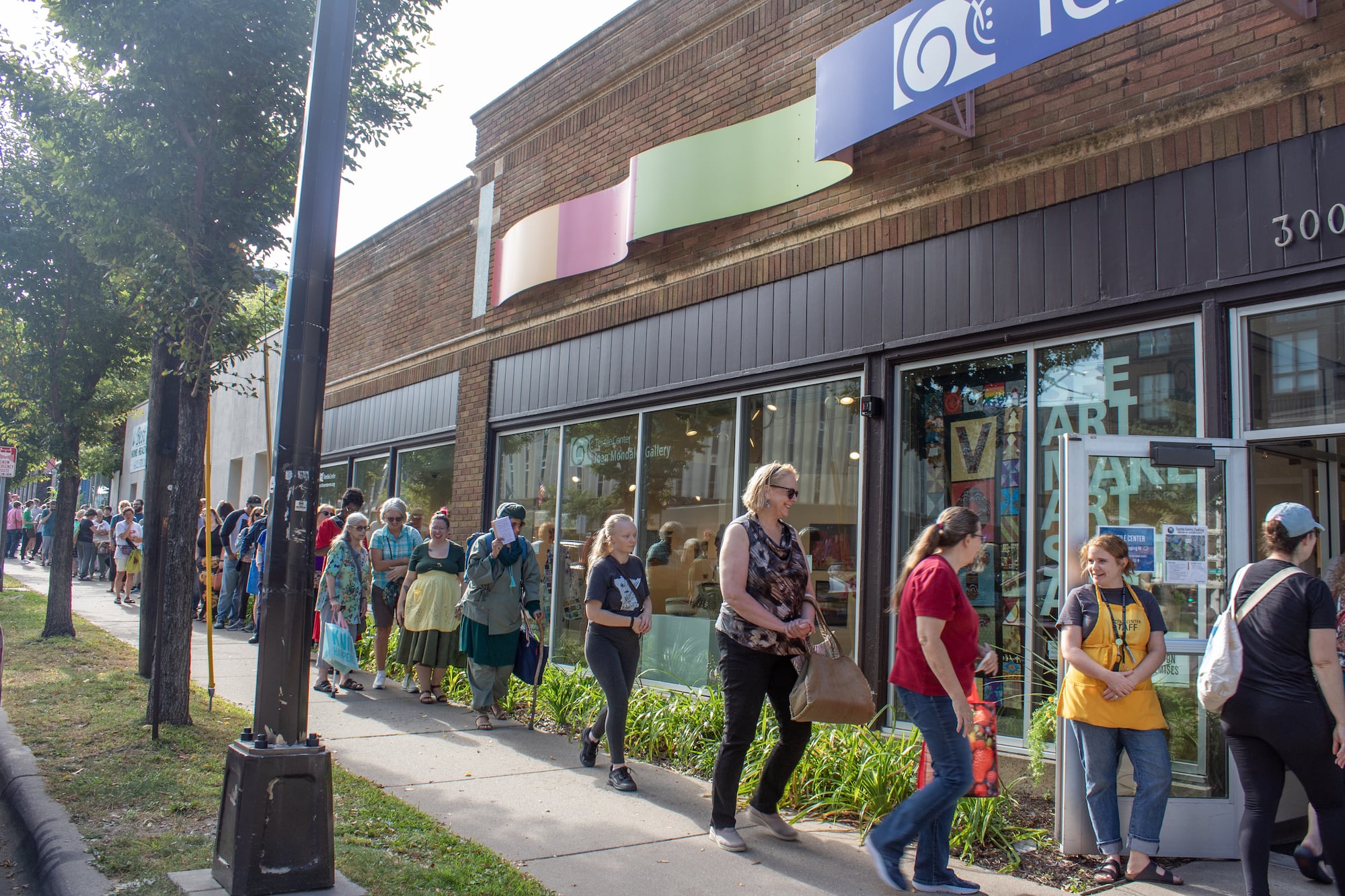 Shoppers line up for the Textile Garage Sale. Textile Center