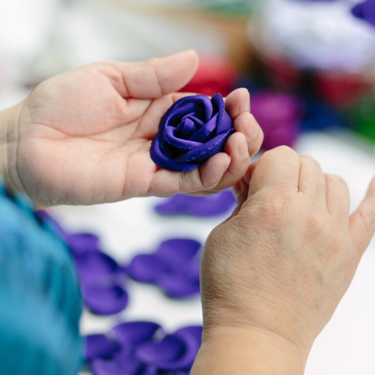 A fabric flower takes shape by hand at M&S Schmalberg, preserving a century-old American craft tradition. M&S Schmalberg