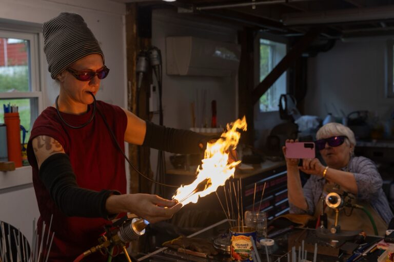 An instructor demonstration in the Snow Farm Flameworking studio. Snow Farm