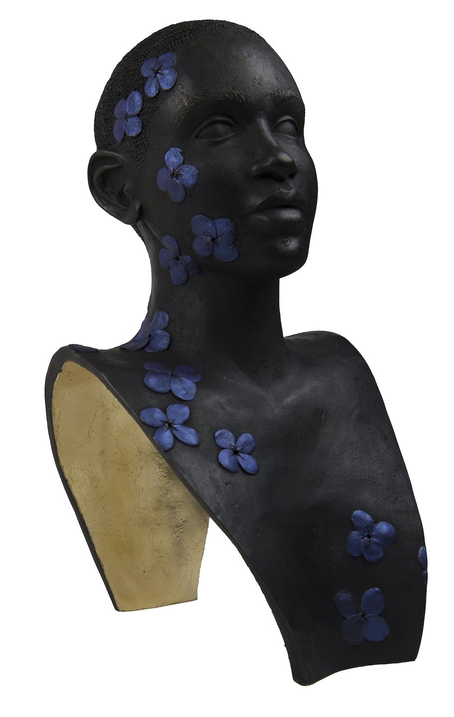 Bust of a female-presenting figure with purple flowers cascading down one side of her face, neck, and chest. Savannah Smith, I Hope Your Flowers Bloom, 2023. Bronze, gold leaf, acrylic. Metal Museum Permanent Collection, 2023.19.1