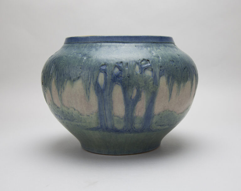 Vase with Oaks and Moss at Dawn Design, 1918. Anna “Fanny” Frances Connor Simpson, artist. Earthenware with underglaze polychrome ornament. Newcomb Art Museum of Tulane. ©Newcomb Art Museum of Tulane
