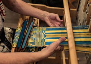 Weaving on a Loom. Photo by David Rorick