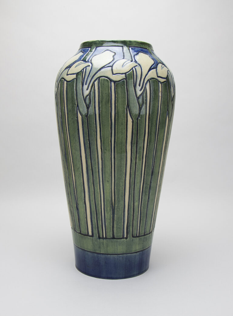 Tall Vase with Iris Design, 1905. Roberta Beverly Kennon, artisan; Joseph Fortune Meyer, potter. Earthenware with polychrome underglaze ornament. Newcomb Art Museum of Tulane. ©Newcomb Art Museum of Tulane