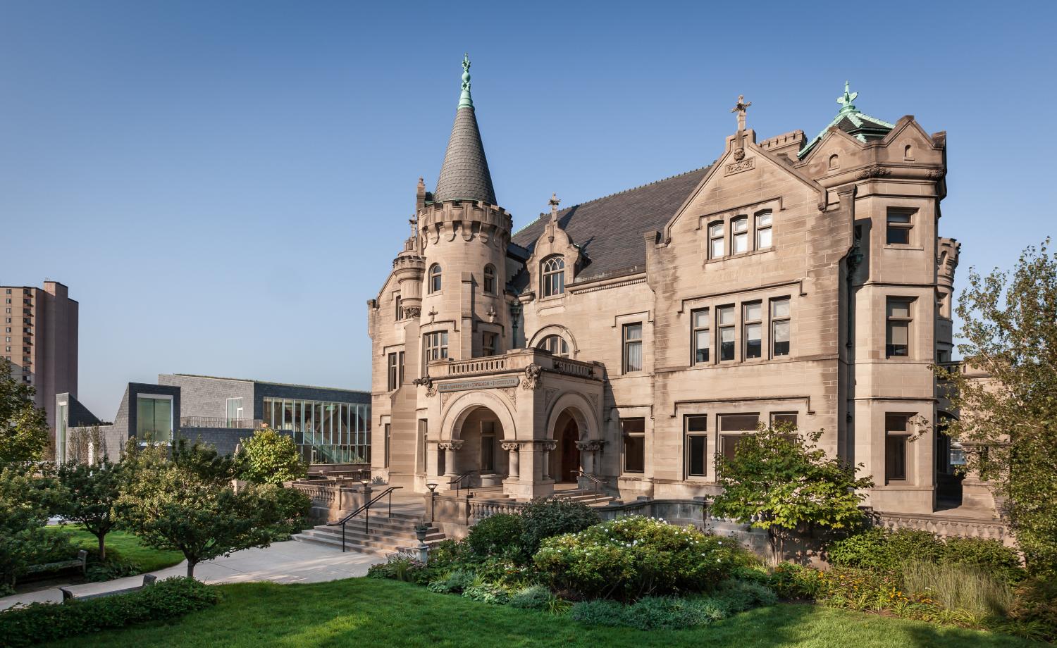 An image of the two buildings on the American Swedish Institute campus, with the Turnblad Mansion in the foreground, and the Nelson Cultural Center in the background. American Swedish Institute