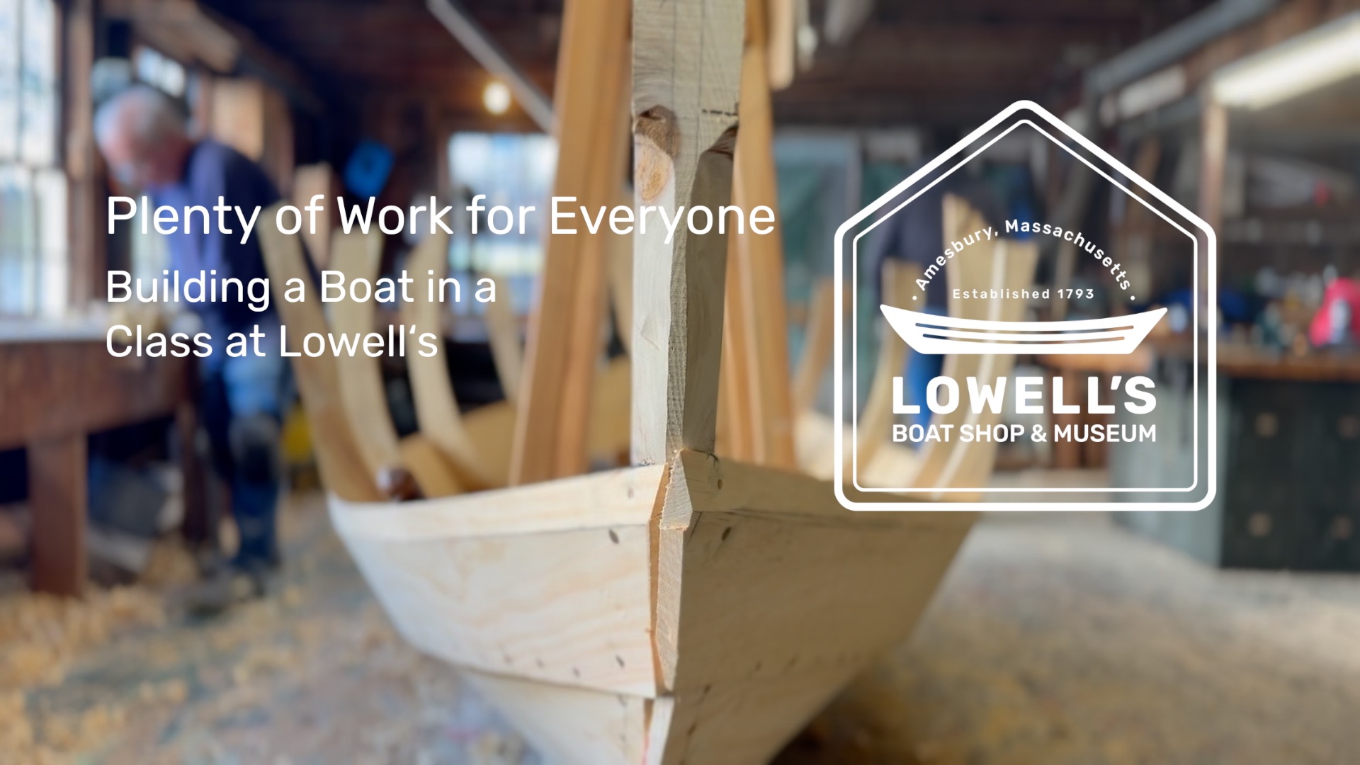 A "Peapod dory" in our classroom as seen from the bow with students in the background. Anne Bryant and Lowell's Boat Shop