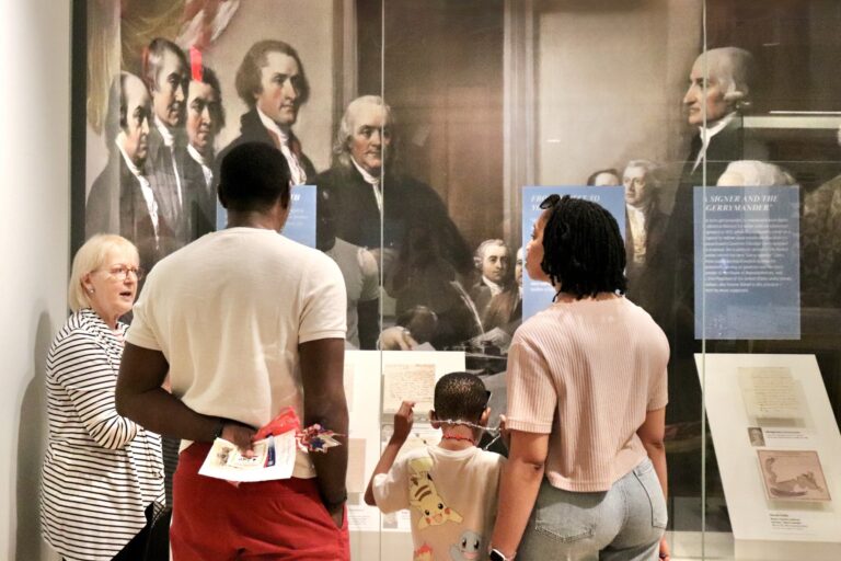 Visitors Touring Museum Exhibition with Docent. Photo credit DAR Museum