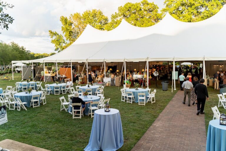 A wide view of the tent during Potters Market at the Mint at Mint Museum Randolph, featuring ceramic artists from across North Carolina and beyond A wide view of the tent during Potters Market at the Mint at Mint Museum Randolph, featuring ceramic artists from across North Carolina and beyond. Photo by Cubbie Captures