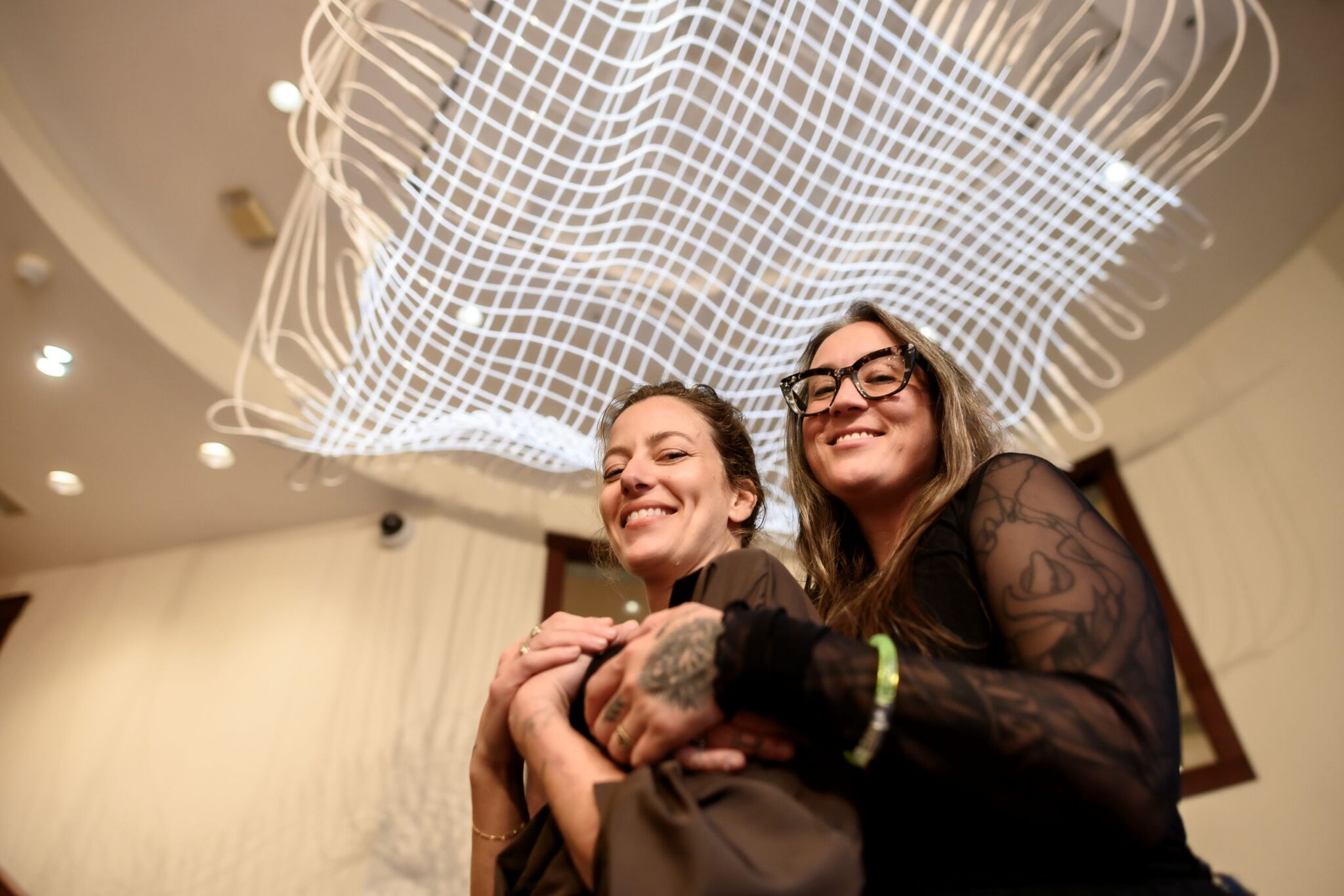 Kelsey Issel and Meryl Patacky with their installtion, True Gravity. Photograph by Lee Speary. Provided by The Rockwell Museum, Corning, NY.