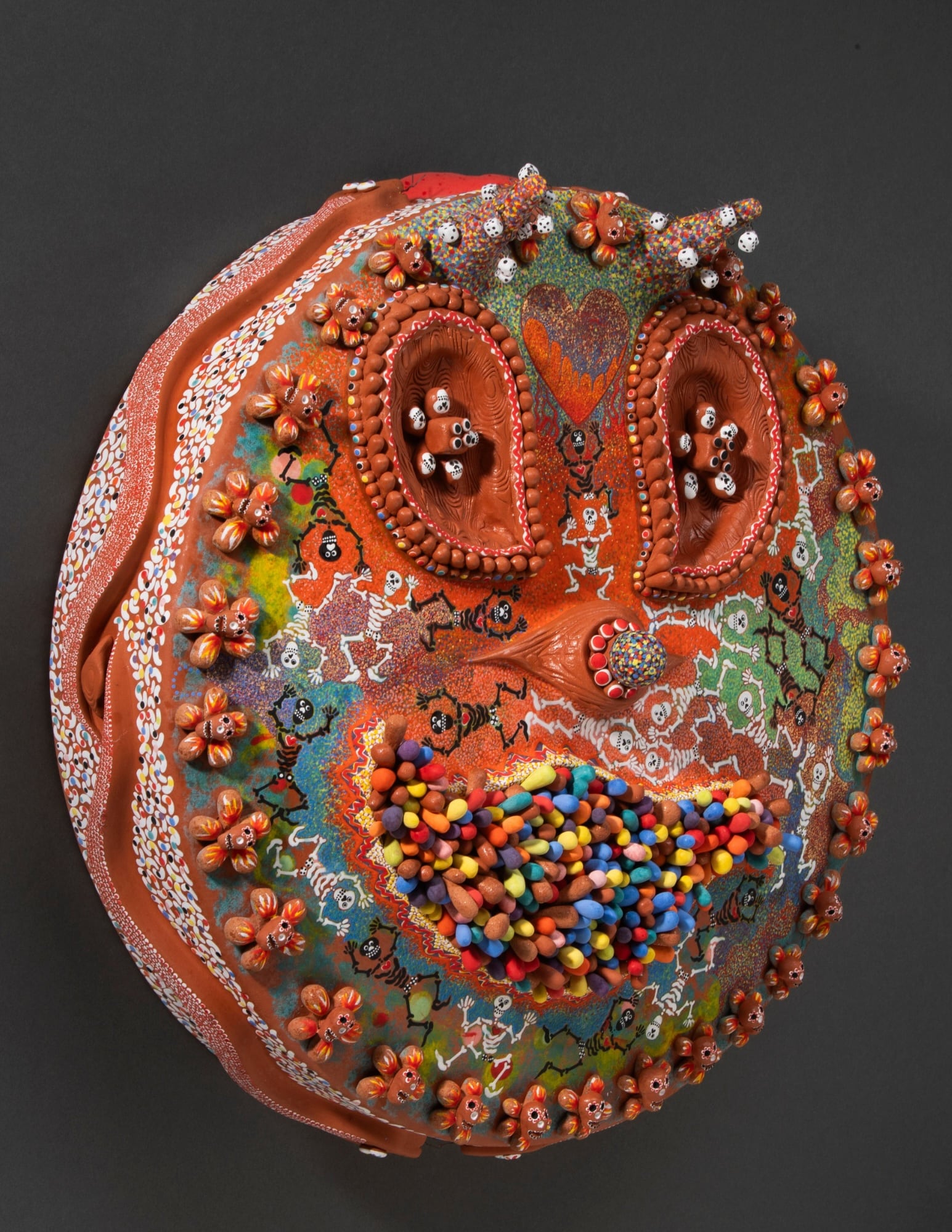 Susie Ketchum, Crybaby. Handbulit terracotta mask with handmade dice charms. Image: Susie Ketchum, Crybaby. Handbulit terracotta mask with handmade dice charms