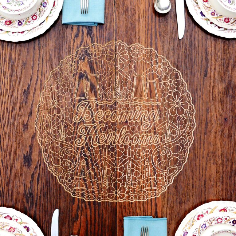 A tablescape set with dishware and a woodcut overlay displaying the show's title. Craft Desert