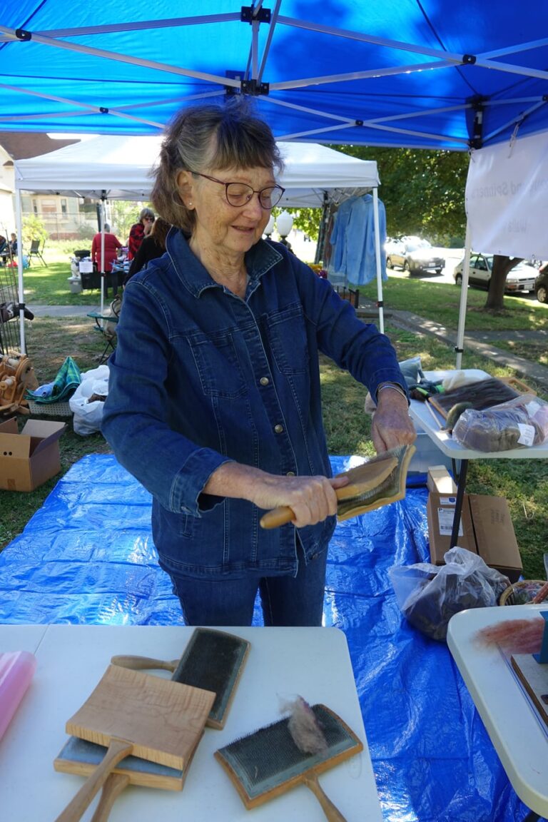 Woman carding Woman carding. Kirkman House Museum