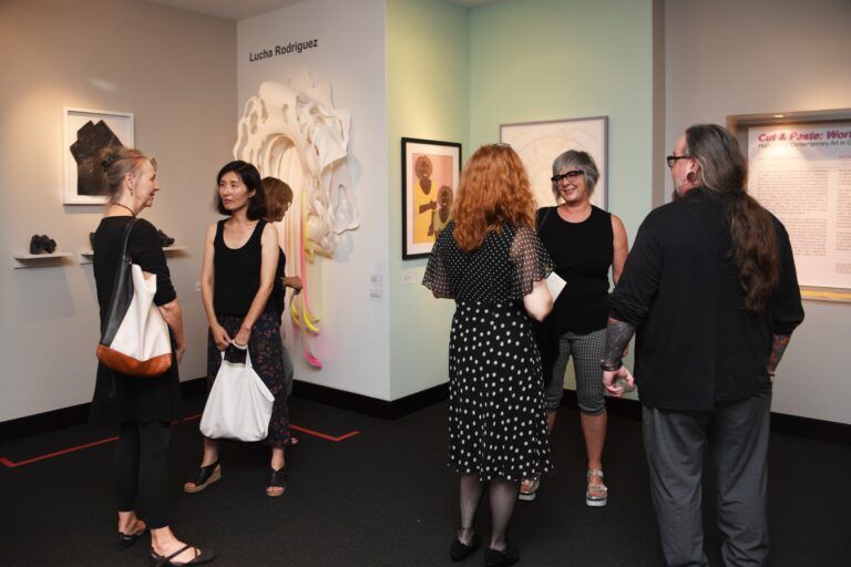 Visitors enjoy an exhibition in the main gallery of the Robert C. Williams Museum of Papermaking. RCW Paper Museum