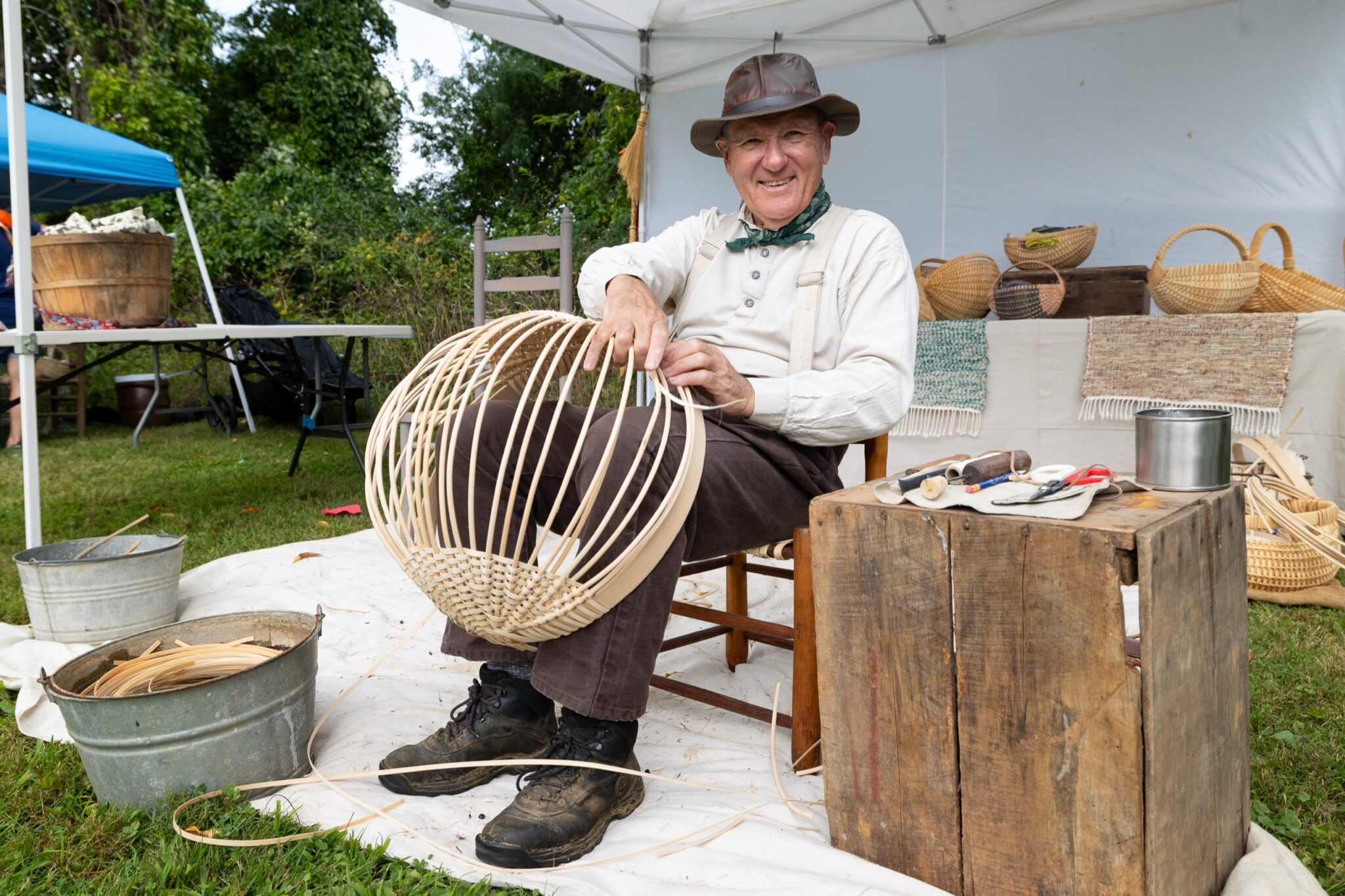 Master basket maker Paul Kitchen demonstrates traditional white oak basket weaving during the Floyd Living Traditions Festival at the Floyd Center for the Arts, preserving and sharing an enduring Appalachian craft tradition. Photo by Hearts Media © Floyd Center for the Arts. Used with permission.