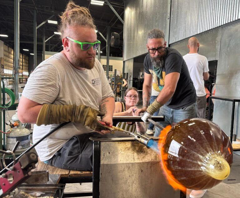 Keegan O’Brien in the hot shop Keegan O'Brien in the hot shop making a glass pumpkin. Image by Belger Arts