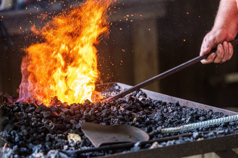 A member of the Old Dominion Blacksmith Association demonstrates traditional blacksmithing during the Floyd Living Traditions Festival, showcasing the skill, craftsmanship, and enduring legacy of Appalachian metalworking. Photo by Robert Simmons © Floyd Center for the Arts. Used with permission.