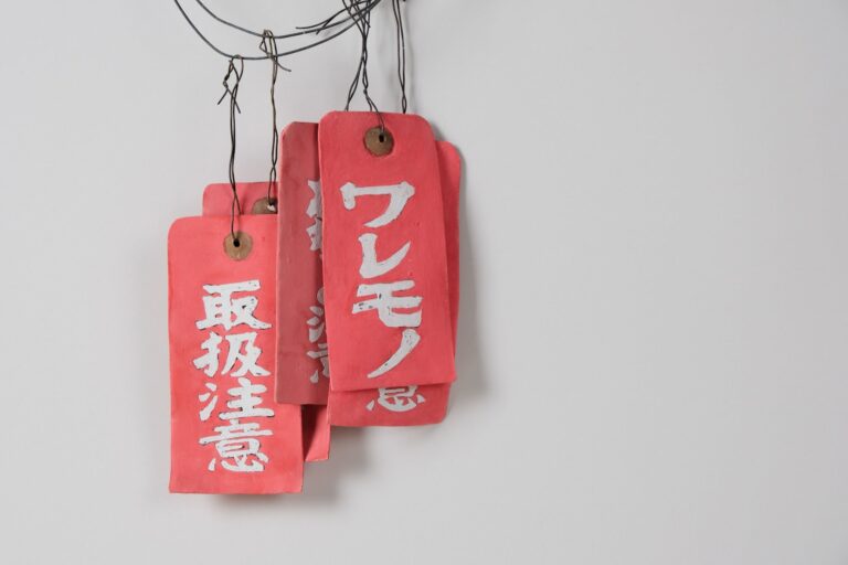Kimiyo Mishima, “Work-Tags,” c. 2018. Silkscreened and hand-painted ceramic, iron. Collection of Raulee Marcus Kimiyo Mishima, "Work-Tags," c. 2018. Silkscreened and hand-painted ceramic, iron. Collection of Raulee Marcus. AMOCA