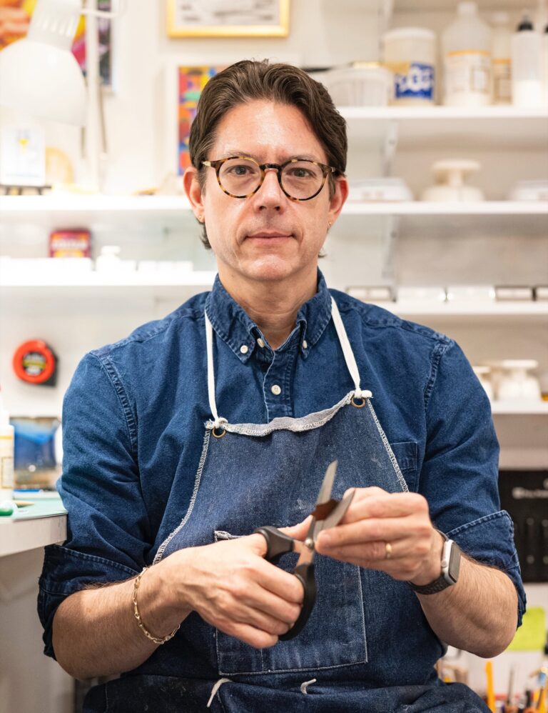 Artist Michael Velliquette is posed in his studio while working on a paper sculpture. Artist Michael Velliquette is posed in his studio while working on a paper sculpture. Michael Velliquette