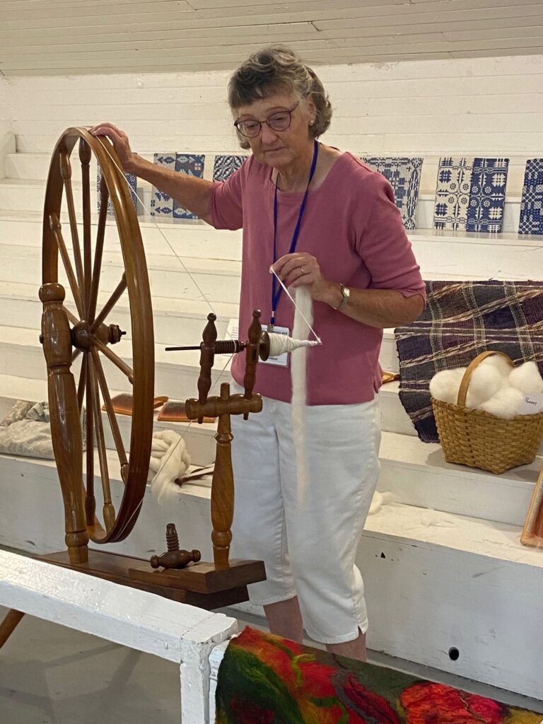 Spinning on Great Wheel Spinning on Great Wheel. Weavers and Spinners of Walla Walla