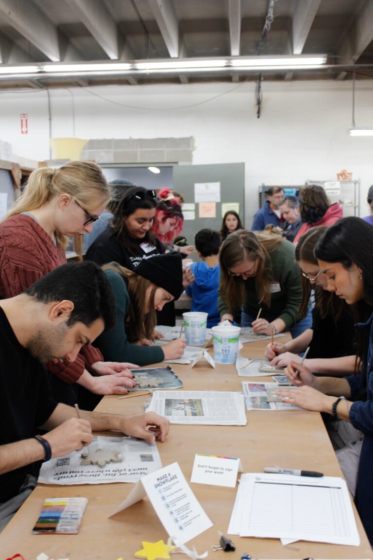 Visitors creating clay snowflakes in a hands-on activity Visitors creating clay snowflakes in a hands-on activity. Northern Clay Center